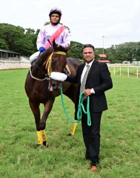 Moon Star (C Umesh up) winner of the MYSORE RACE CLUB MILLION 2025, being led in by trainer Aravind G on Wednesday racecs at Mysore.
